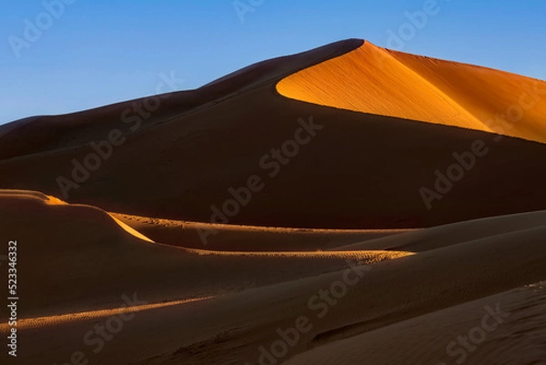 Fototapeta The dunes of Erg Chegaga at sunset. Erg Chegaga (or Chigaga) is one of two major Saharan ergs of the Sahara in Morocco. It is the largest and wildest of Morocco.