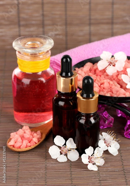 Fototapeta Spa composition with aroma oils on table close-up