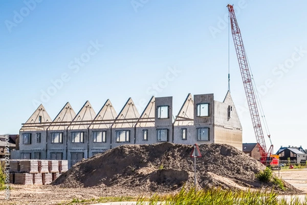 Fototapeta Construction of new homes in a new residential area.