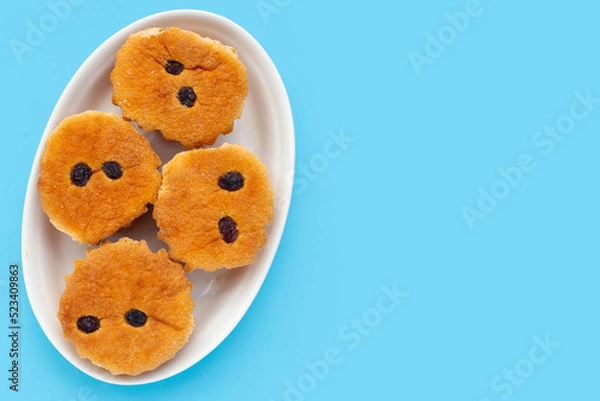 Obraz Mini castella cake on blue background.