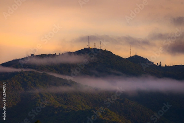 Obraz sunrise in the mountains with clouds and communication towers