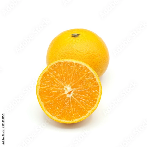Fototapeta Halved oranges and one oranges look fresh appetizing on white background.