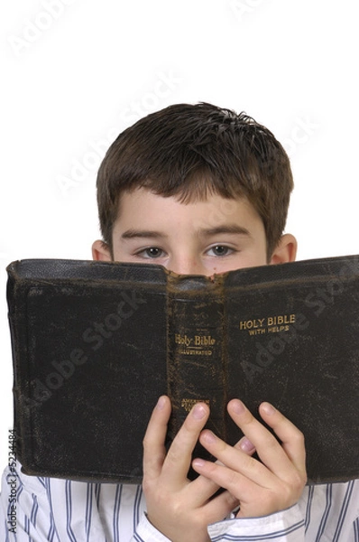 Fototapeta Boy Peering Over Bible