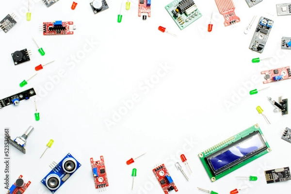 Fototapeta Top view arduino components and modules, Electric parts on a white background. Concept of a technical background. 