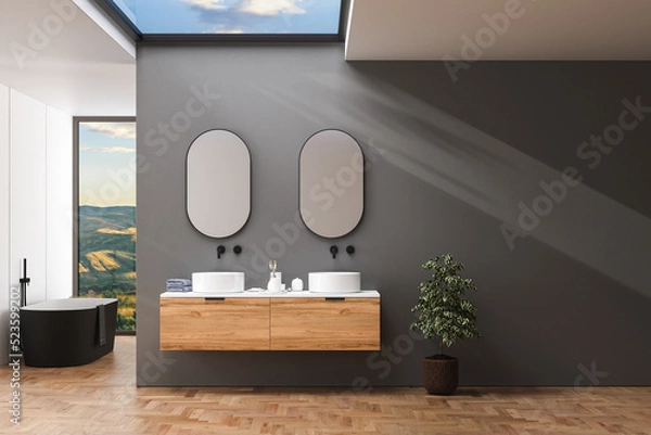 Fototapeta Dark bathroom interior with hardwood parquet floor, black bathtub and double sink with white countertop, mirrors, sky view. Minimalist black bathroom with modern furniture. 3d rendering
