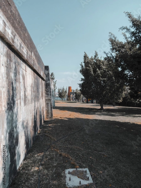 Obraz Park with brick mill and large trees