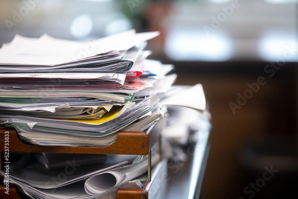 Fototapeta Pile of unfinished documents on office desk, Stack of business paper