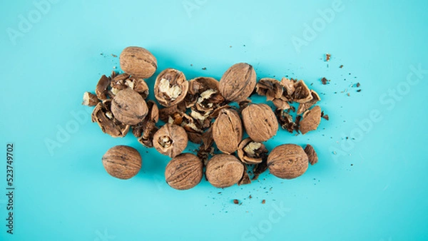 Obraz Top view walnuts on blue background