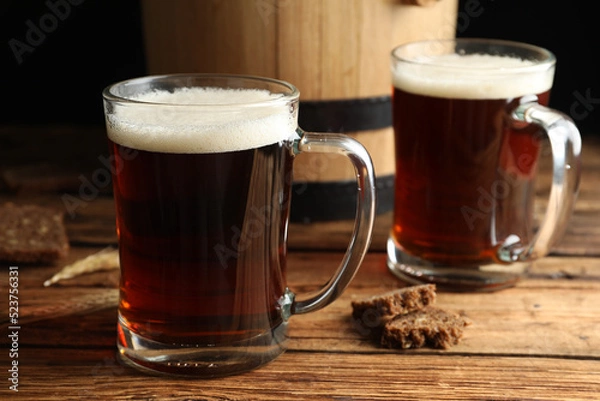 Fototapeta Delicious kvass, bread and spikes on wooden table