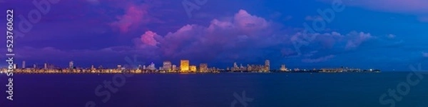 Fototapeta A view of Mumbai's Marine Drive closer to night with a few purple clouds. Overlooking the Back Bay, this area marks the southernmost part of the island city of Mumbai jutting out into the Arabian Sea.