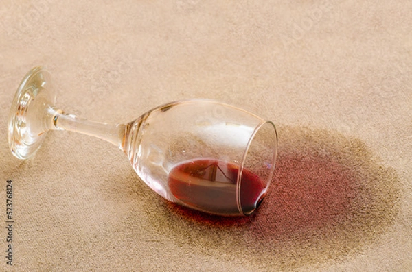 Fototapeta Red wine stain on a carpet inside a living room
