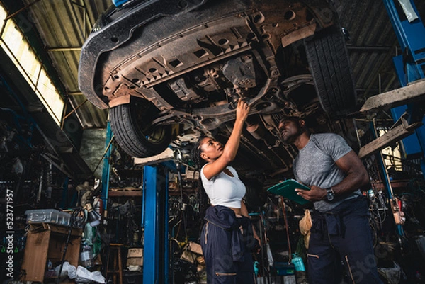 Obraz Professional mechanics are checking the car is suspension problems thoroughly.