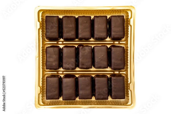 Fototapeta Dark chocolate pralines in a golden square box