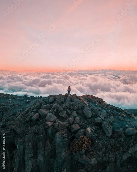 Fototapeta top of the halekakala volcano in Maui, Hawaii during sunset with a sea of clouds