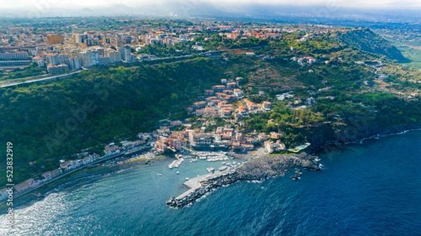 Fototapeta Timpa di Acireale vista aerea dall'alto su Santa Maria la scala  con mare  e cielo blu