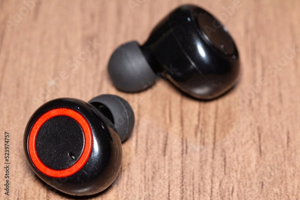 Obraz bluetooth headphones on the table