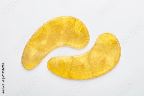 Obraz Gold hydrogel eye patches on white background.