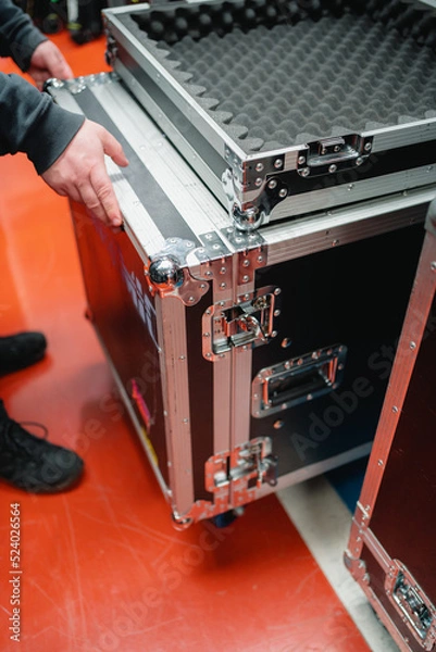 Obraz a worker taking a hardcase to work