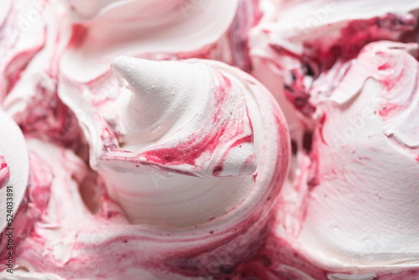 Fototapeta Frozen Cherry flavour gelato - full frame detail. Close up of a white surface texture of Ice cream covered with red stripes.