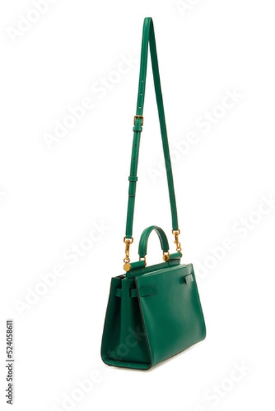 Fototapeta Big women's emerald Leather Handbag Isolated on White Background. Female green handle, shoulder bag with long strap.  Mock up, template