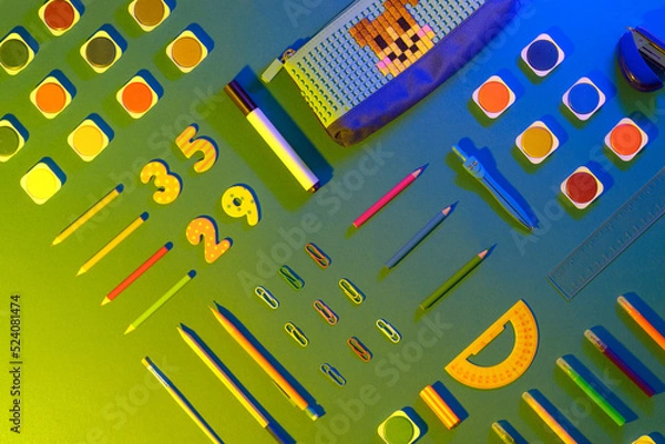 Fototapeta Flat lay with different school supplies on colored background. Copy space. Top view.