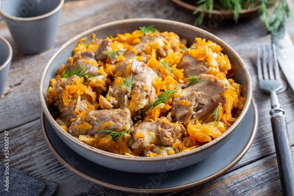 Obraz stewed turkey necks with vegetables, selective focus