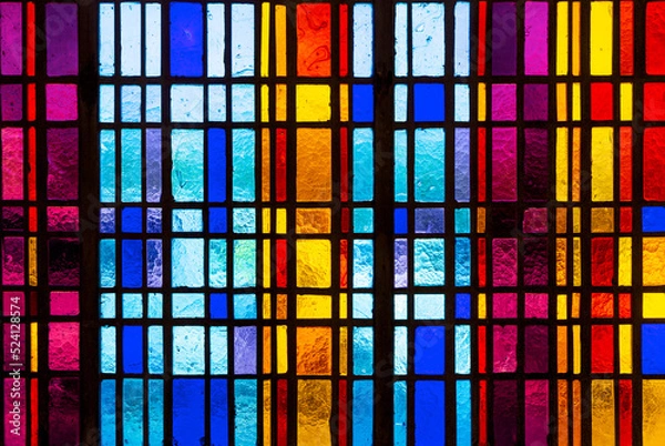 Fototapeta Colorful stained glass window in modern design with blue, red, violet and yellow pieces of glass
