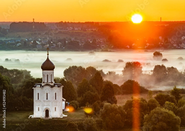 Obraz Sun is rising over the Church of the Intercession on the Nerl river (Vladimir region, Russia)