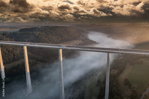 Fototapeta aerial view of a  highway bridge in the sunrise 