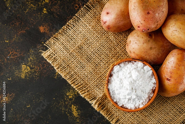 Obraz potato starch on a dark rustic background