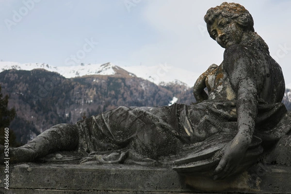 Fototapeta Statue with Carpathians in the background in Peles Castle in Romania