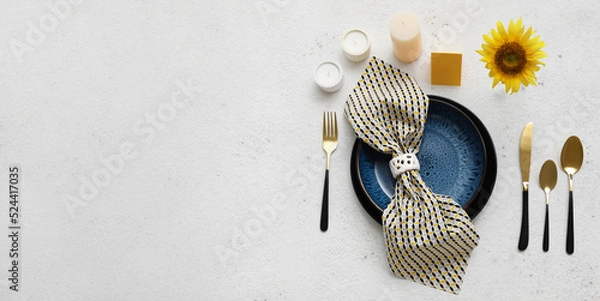 Fototapeta Beautiful table setting with fresh sunflower and aroma candles on light background with space for text