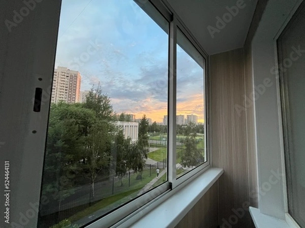 Obraz view from the apartment window of the sunset in the city