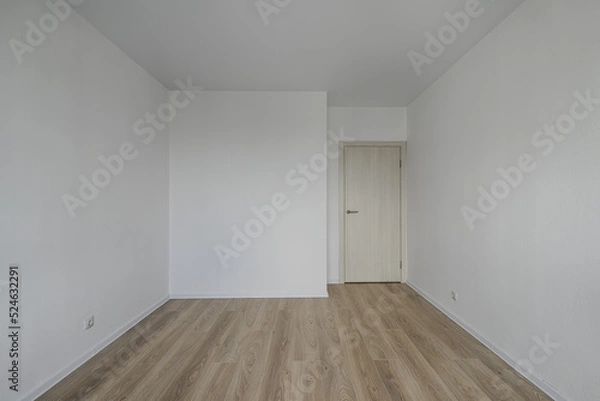 Obraz Empty room after repairs in an apartment building. Standard, stereotype fresh renovated room with wooden floor