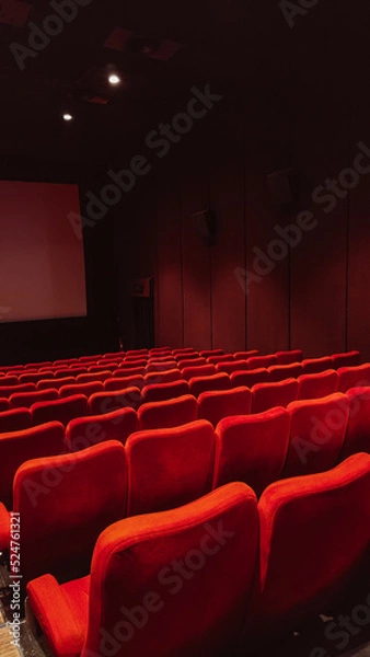Fototapeta cinema auditorium with red seats