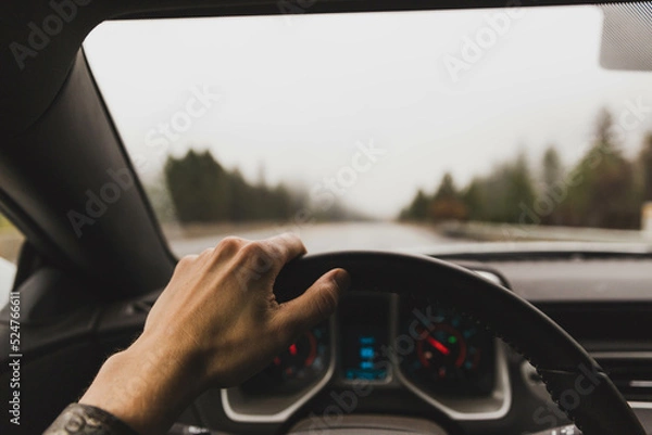 Fototapeta Driver point of view in sports car, driving on wet highway, fall or winter travel