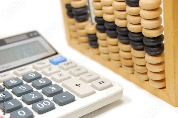 Fototapeta Abacus and calculator isolated on white