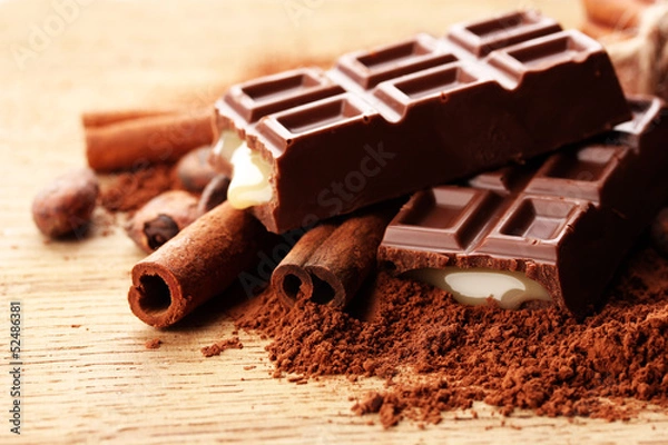 Fototapeta Composition of chocolate sweets, cocoa and  spices