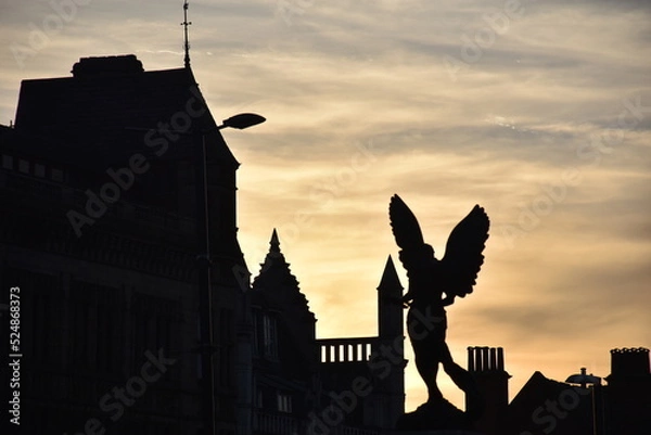 Obraz Silhouette of building and angel statue in the sunset of Leeds, England