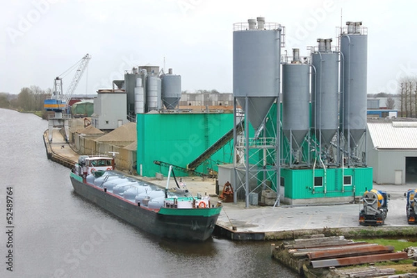 Obraz Ship in harbor of the cement plant. Netherlands