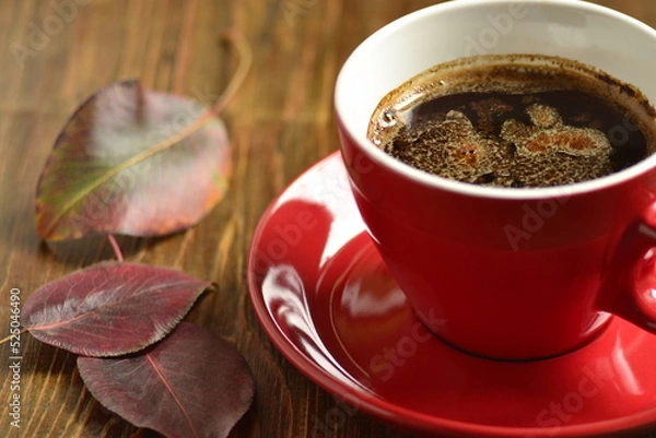 Obraz Сup of black coffee with red leaves. Fall composition.