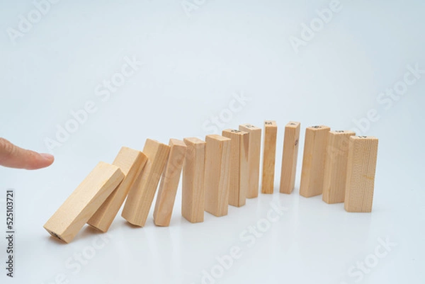 Fototapeta Expressing various concepts such as dominoes and business using wood jenga