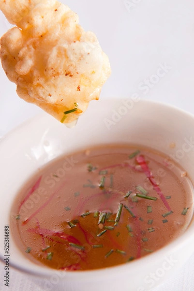 Fototapeta Deep-fried prawn dipped into sweet chili sauce.

