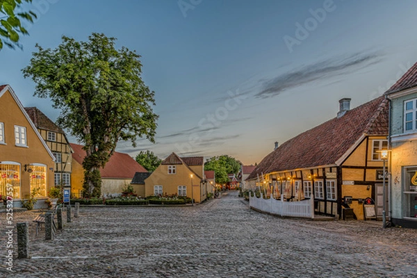 Fototapeta The square in the idyllic town Mariager in the dusk twilight hour