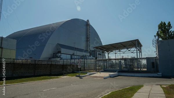 Fototapeta The fourth reactor of the Chernobyl nuclear power plant under a new safe sarcophagus. Exclusion Zone on a summer sunny day