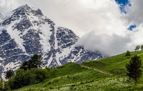 Fototapeta Beautiful mountain landscape. Alpine climbing. Sunset in the mountains. The Caucasus is a region spanning Europe and Asia. Elbrus region. Mountains landscape. 