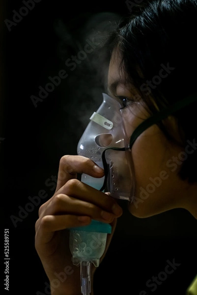 Obraz Close up sick Yong asian girl with face oxygen mask,on bed in hospital, Healthcare workers in the Coronavirus Covid19 pandemic