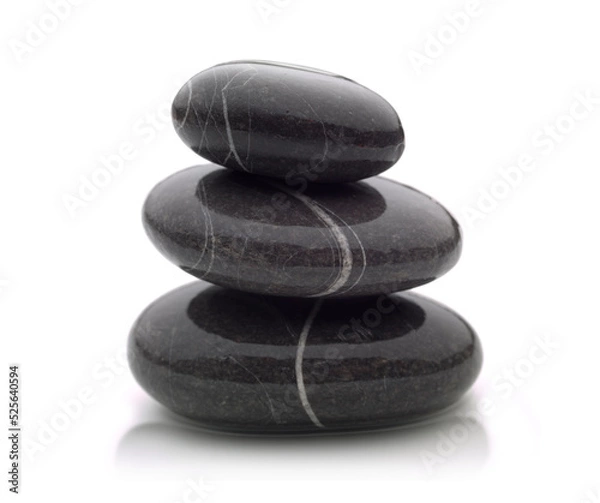 Fototapeta three beautiful shiny black river stones stacked on top of each other with a shadow at the base