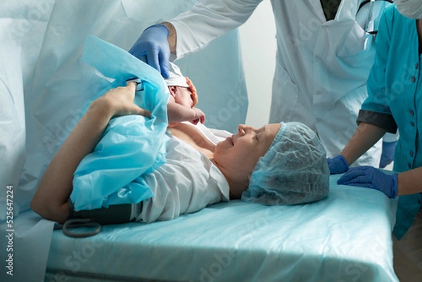 Obraz Mother look to her newborn baby in hospital