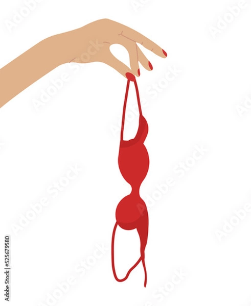 Obraz Hand holding red bra in consept of breast awareness. Brassiere hanging isolated.